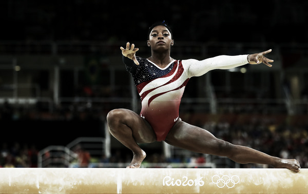 ​ Simone Biles performing a wolf turn on balance beam. Photo Credit: Lars Baron of Getty South AmericaSimone Biles performing a wolf turn on balance beam. Photo Credit: Lars Baron of Getty South America Click and drag to move ​