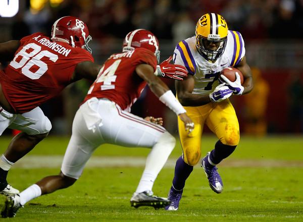 Leonard Fournette runs the ball against Alabama at Bryant-Denny Stadium in Tuscaloosa/Getty Images
