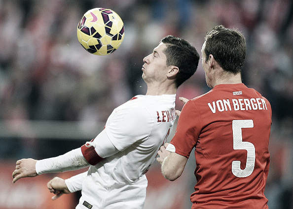 Above: Robert Lewandowski battling with Steven von Bergen in Poland's 2-2 draw with Switzerland | Photo: AFP/Janek Skazynski 