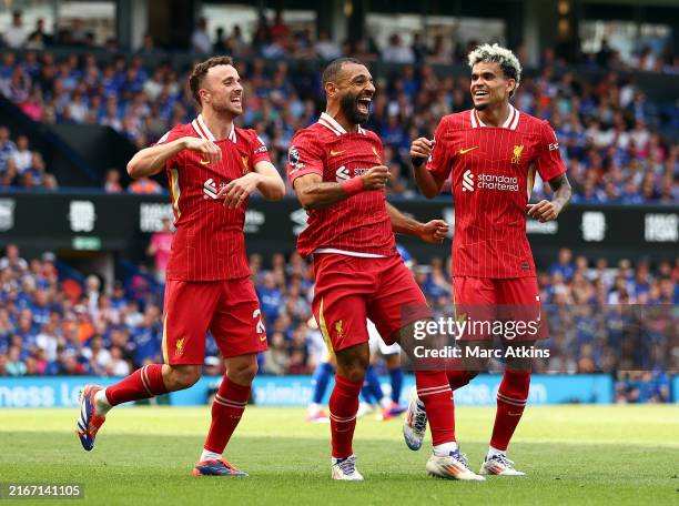 Mo Salah (centre) celebrates scoring Liverpool's second goal against Ipswich alongside &lt;strong&gt;&lt;a  data-cke-saved-href='https://www.vavel.com/en-us/soccer/2024/02/03/1171114-arsenal-vs-liverpool-premier-league-preview-ahead-of-blockbuster-clash-between-title-rivals.html' href='https://www.vavel.com/en-us/soccer/2024/02/03/1171114-arsenal-vs-liverpool-premier-league-preview-ahead-of-blockbuster-clash-between-title-rivals.html'&gt;Diogo Jota&lt;/a&gt;&lt;/strong&gt; (left) and &lt;strong&gt;&lt;a  data-cke-saved-href='https://www.vavel.com/en-us/soccer/2024/04/21/1180333-sublime-alexander-arnold-strike-gets-liverpool-back-to-winning-ways.html' href='https://www.vavel.com/en-us/soccer/2024/04/21/1180333-sublime-alexander-arnold-strike-gets-liverpool-back-to-winning-ways.html'&gt;Luis Diaz&lt;/a&gt;&lt;/strong&gt; (right) | Photo: Getty Images