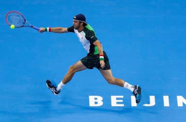 Paolo Lorenzi chases down a forehand during his first round loss. Photo: China Open