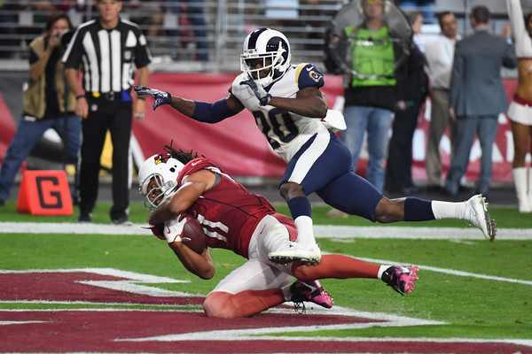 Wide receiver Larry Fitzgerald #11 of the Arizona Cardinals scores a touchdown over free safety Lamarcus Joyner #20 of the Los Angeles Rams. |Source: Norm Hall/Getty Images North America|