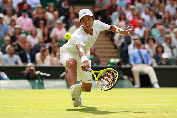 Yen-Hsun Lu lunges for a volley during his second round loss. Photo: Adam Pretty/Getty Images