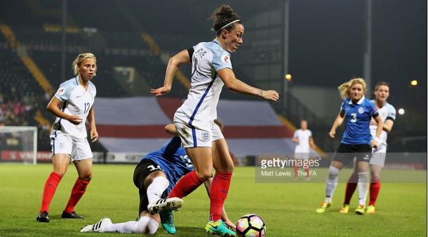 Lucy Bronze battles against an Estonia player | Photo: Matt Lewis - The FA