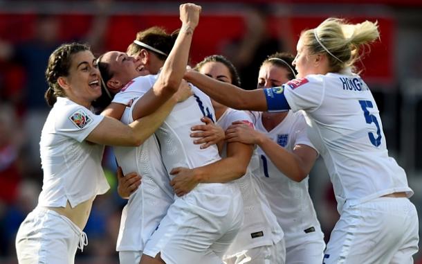 Bronze is mobbed by her teammates after scoring versus Norway (Source: The Telegraph) 