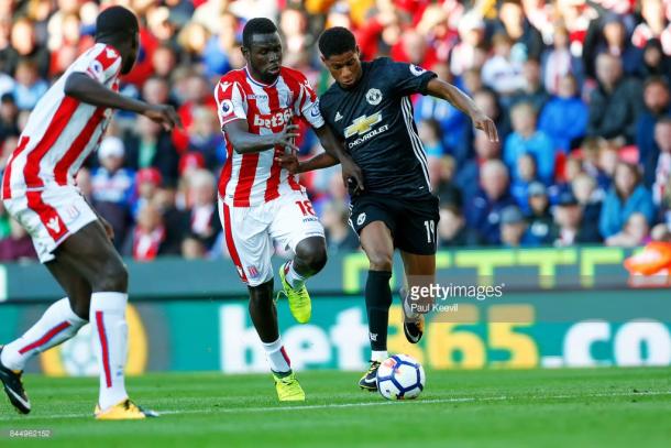 Mame Biram Diouf battles Marcus Rashford for the ball last weekend. Source | Getty Images.