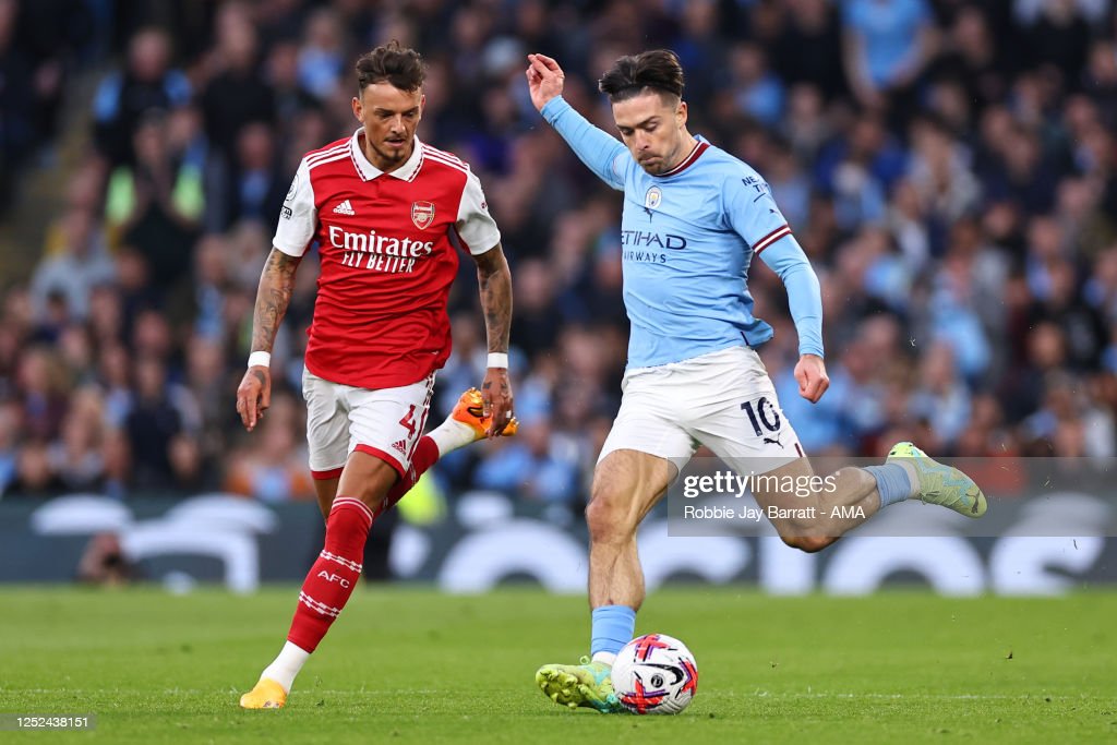 MANCHESTER, ENGLAND - APRIL 26: Ben White of Arsenal and Jack Grealish of Manchester City during the Premier League match between Manchester City and Arsenal FC at Etihad Stadium on April 26, 2023 in Manchester, United Kingdom. (Photo by Robbie Jay Barratt - AMA/Getty Images)