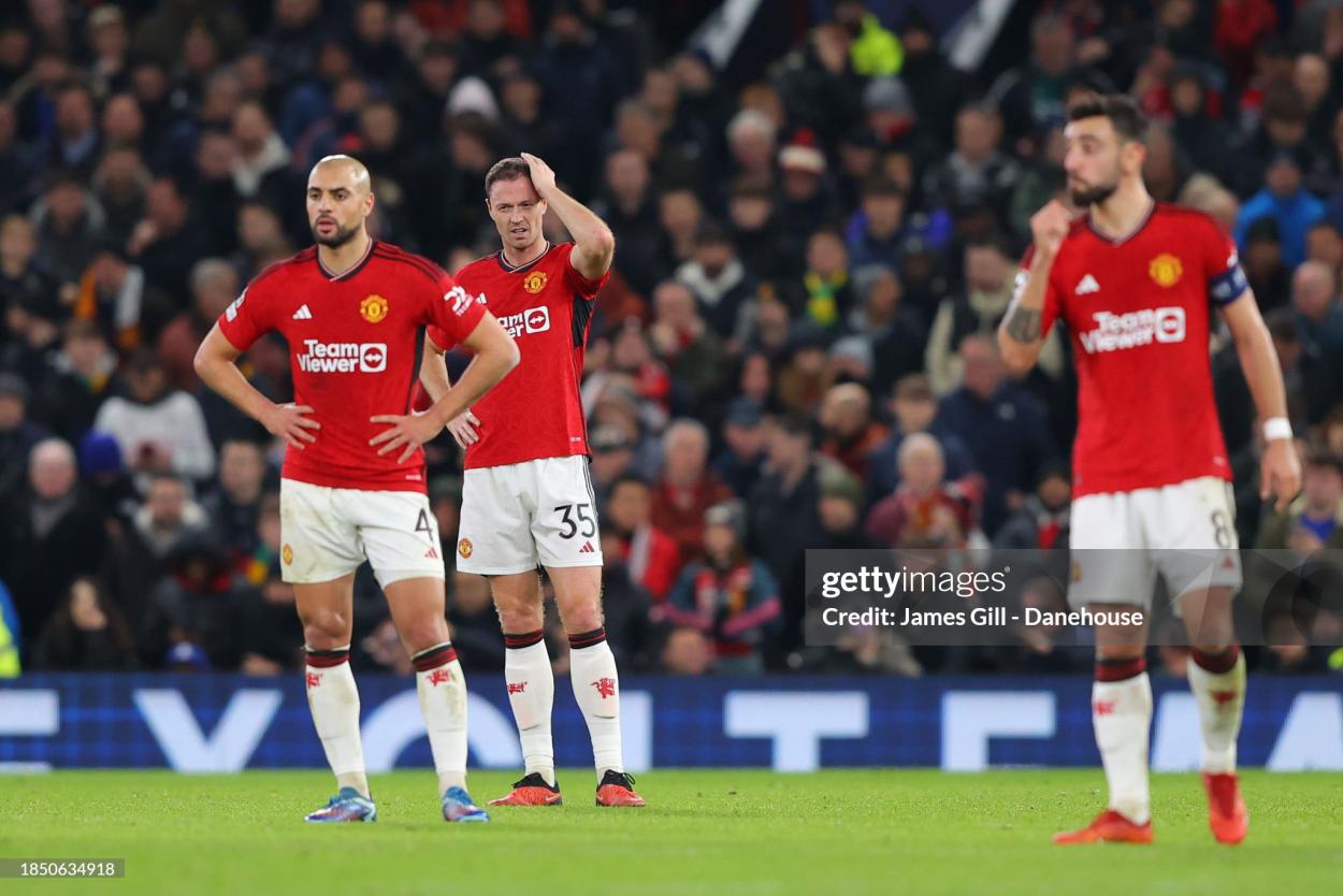 Jonny Evans of Manchester United looks dejected after they concede the opening goal during the UEFA Champions League match between Manchester United and FC Bayern München at Old Trafford on December 12, 2023 in Manchester, England. (Photo by James Gill - Danehouse/Getty Images)