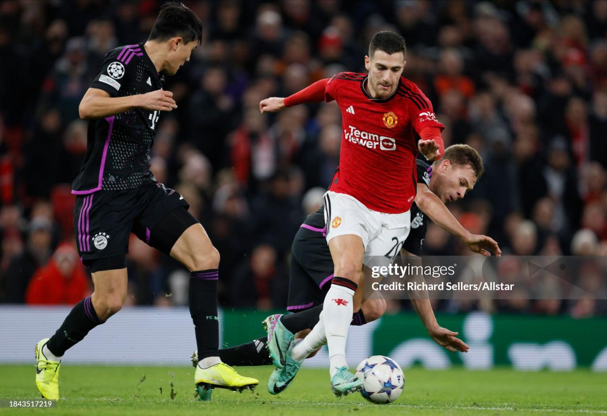 Kim Min-Jae of Bayern Munich, Diogo Dalot of Manchester United and Joshua Kimmich of Bayern Munich challenge during the UEFA Champions League match between Manchester United and FC Bayern Munchen at Old Trafford on December 12, 2023 in Manchester, England. (Photo by Richard Sellers/Sportsphoto/Allstar via Getty Images)