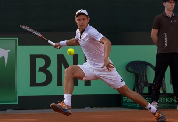 Majchrzak chases down a forehand. Photo: Davis Cup