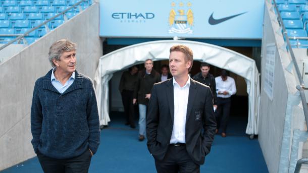 Pellegrini being shown around the Etihad on his first day. (Source: MCFC)