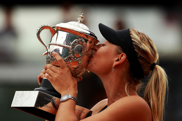 Victory never tasted so sweet: Maria Sharapova kisses the Coupe Suzanne Lenglen after winning the 2012 French Open to complete the Career Grand Slam. She has won just one Grand Slam since then: the 2014 French Open. | Photo: Clive Brunskill/Getty Images