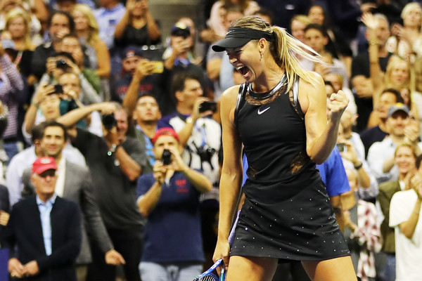 A very delighted Maria Sharapova celebrates after defeating Simona Halep in the first round of the 2017 U.S. Open. | Photo: Elsa/Getty Images