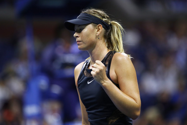 Maria Sharapova celebrates winning a point during her first round match | Photo: Clive Brunskill/Getty Images North America