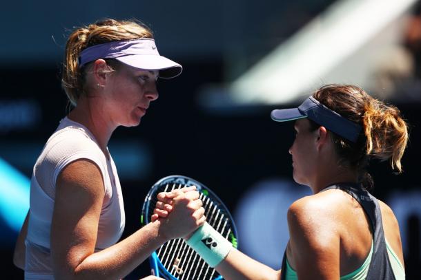 Maria Sharapova and Tatjana Maria shake hands after their first round match. (Photo: Clive Brunskill/Getty Images)