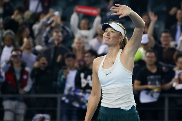 Maria Sharapova applauds the supportive fans after grabbing the win | Photo: Zhizhao Wu/Getty Images AsiaPac