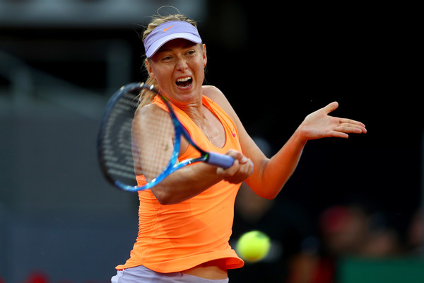 Maria Sharapova hits a forehand during her second-round match against Eugenie Bouchard at the 2017 Mutua Madrid Open. | Photo: Clive Rose/Getty Images