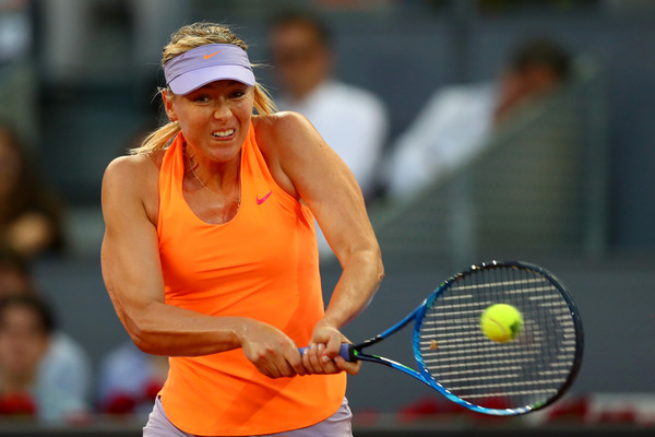 Maria Sharapova hits a strong backhand | Photo: Clive Rose/Getty Images Europe