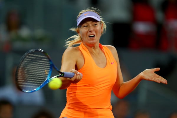 Maria Sharapova hits a powerful forehand | Photo: Clive Rose/Getty Images Europe