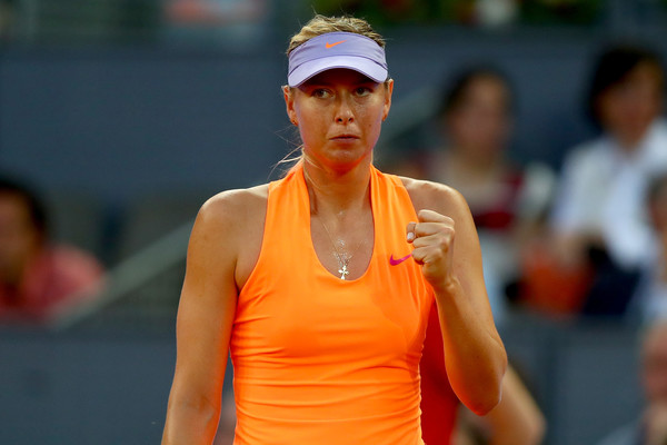 Maria Sharapova celebrates after winning a point during her second-round match against Eugenie Bouchard at the 2017 Mutua Madrid Open. | Photo: Clive Rose/Getty Images