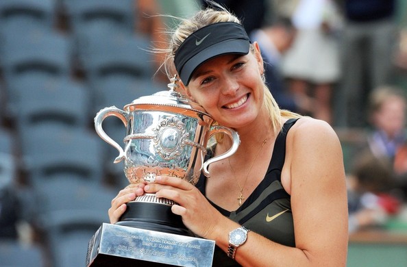 Maria Sharapova holding onto her French Open trophy | Photo: Bauer Griffin