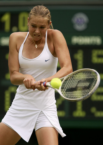Maria Sharapova in action at the 2004 Wimbledon Championships | Photo: Mike Hewitt/Getty Images Sport