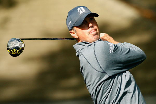 Matt Kuchar watches his drive travel down the fairway. Photo: Tyler Lecka/Getty Images