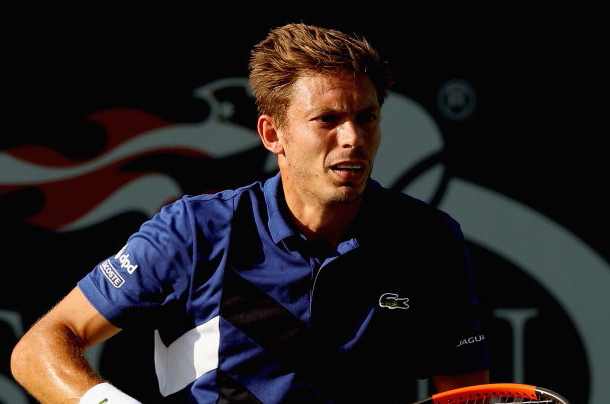 Photo: Matthew Stockman/Getty Images-Nicolas Mahut sneaks in for a volley.