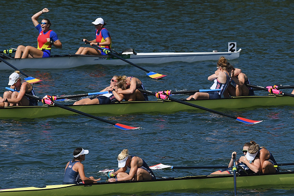 The crews of Romania, America and Great Britain celebrate after taking the medals (Getty/Matthias Hangst)