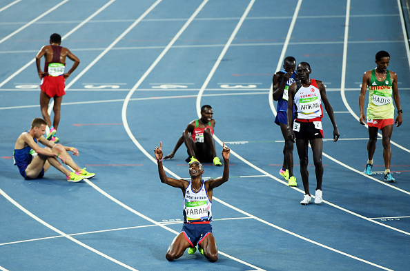 The scene after the race, with Mo Farah on his knees (Getty/Matthias Hangst)