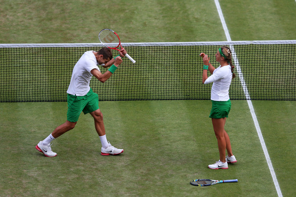 Max Mirnyi and Victoria Azarenka celebrate after winning the gold medal in mixed doubles at the London 2012 Olympics.