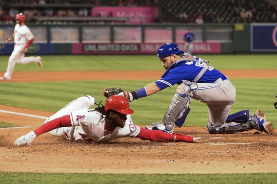 Cameron Maybin avoids tag to score go-ahead run for the Angels. | Photo: USA Today Sports