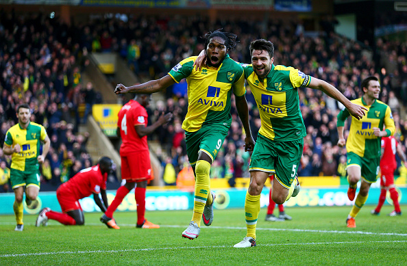 Dieumerci Mbokani and Russel Martin celebrate Norwich's first goal of the afternoon. (Getty)