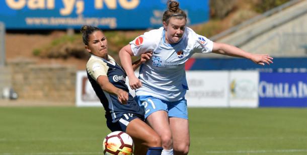 McCaskill (right) and Debinha (left) battle for the ball l photo: Grant Halverson/ ISI Photos