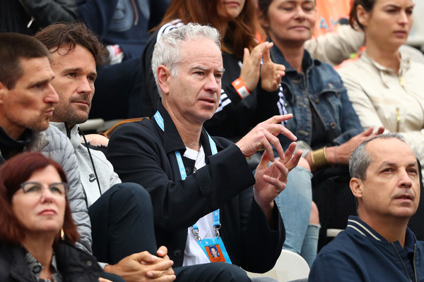 McEnroe (center) seated with Raonic's team at the French Open. Photo: Julian Finney/Getty Images