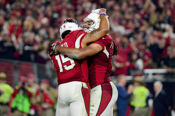 Michael Floyd and Larry Fitzgerald celebrating after a touchdown |Source: Jennifer Stewart/Getty Images North America|