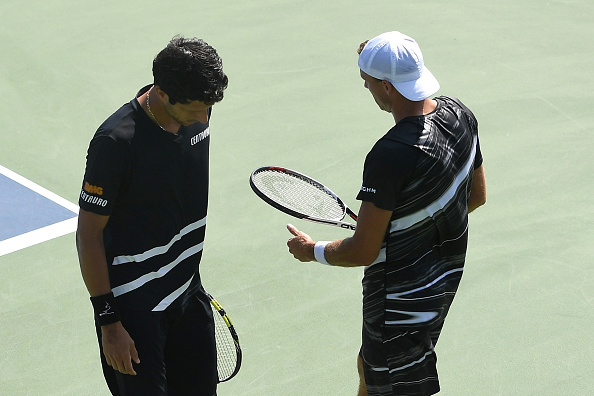 Lukasz Kubot and Marcelo Melo in conversation during their win (Photo: Sarah Stier/Getty Images)