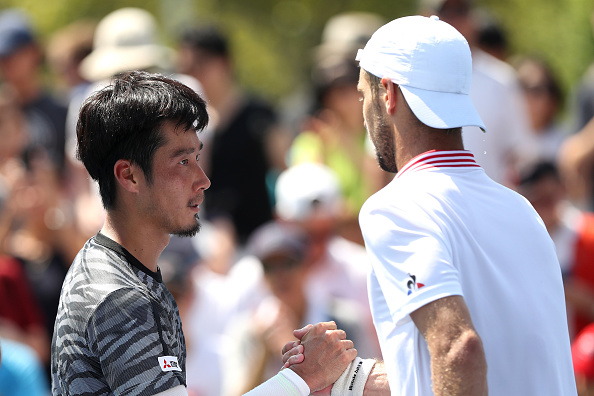 Yuichi Sugita congratulates Richard Gasquet on his victory (Photo: Matthew Stockman/Getty Images)