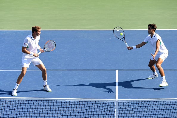 Pierre-Hugues Herbert strikes a volley (Photo: Sarah Stier/Getty Images)