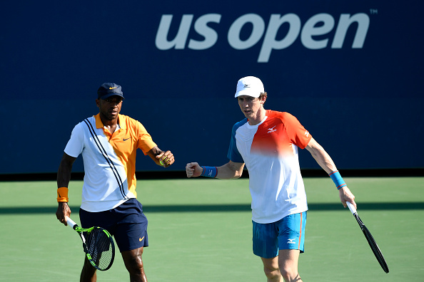 Nicholas Monroe and John-Patrick Smith fist bump after taking the second set (Photo: Sarah Stier/Getty Images)