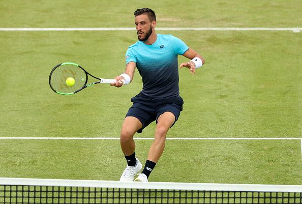 Damir Dzumhur plays a shot at the Fever-Tree Championships (Photo: Matthew Stockman/Getty Images)