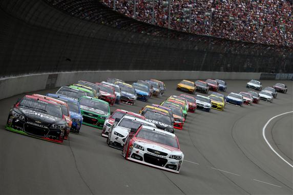 The field runs into Turn one during last year's race.