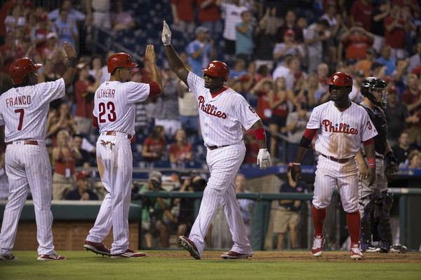 The Philadelphia Phillies celebrating a grand slam by Ryan Howard. Photo Credit: Mitchell Leff of Getty Images