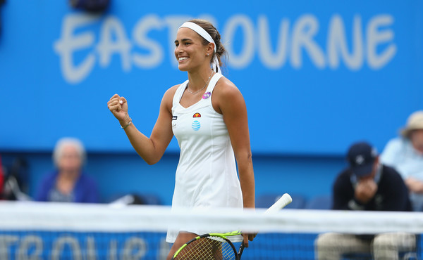 Monica Puig celebrates after defeating Caroline Wozniacki in the third round of the 2016 Aegon International. | Photo: Steve Bardens/Getty Images