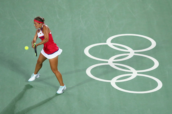 Monica Puig celebrates hits a backhand during her women’s singles gold medal match against Angelique Kerber on Day 8 of the Rio 2016 Olympic Games. | Photo: Dean Mouhtaropoulos/Getty Images South America