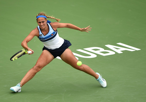 Monica Puig hits a forehand during her first-round match against Yaroslava Shvedova at the 2017 Dubai Duty-Free Tennis Championships. | Photo: Tom Dulat/Getty Images