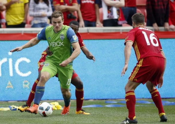 Seattle's Jordan Morris takes on Real Salt Lake's Aaron Maund and Chris Wingert | Photo: AP Photo/Kim Raff