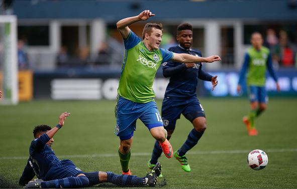 ordan Morris #13 of the Seattle Sounders FC dribbles against Amadou Dia #13 of Sporting Kansas City at CenturyLink Field on March 6, 2016 in Seattle, Washington. (Photo by Otto Greule Jr/Getty Images