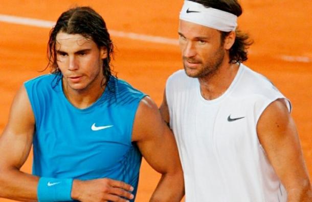 Nadal (left) and Moya meet at the net after Nadal's victory over his mentor in 2008. Photo: Fabian Bimmer/AP