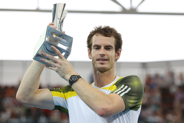 Andy Murray hoists the trophy after winning the 2013 title. Photo: Chris Hyde/Getty Images